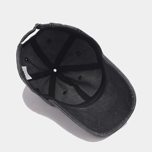 Charcoal grey washed denim baseball cap with six-panel structure and metal buckle