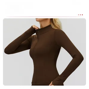Detail of slim-fit brown sports jacket showing stand-up collar and zipper chin guard