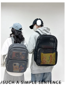 Close-up of breathable mesh backpack showing double front zipper pockets in black and grey