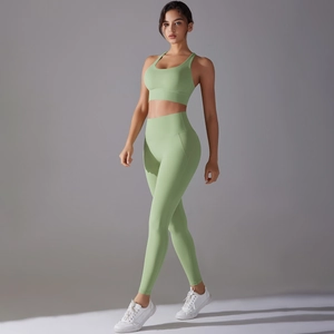 Close-up of the high waist cut and elastic fabric on the green yoga set