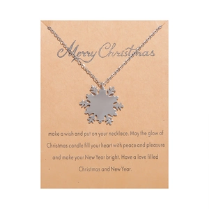 Silver snowflake pendant necklace displayed on a Merry Christmas greeting gift card