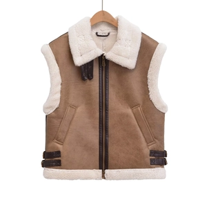 Brown faux suede and shearling vest featuring metal buckle straps and zip closure
