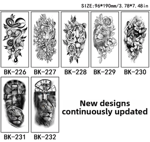 Detail of black and white sketch temporary tattoos featuring lions, snakes and floral motifs