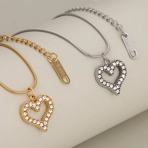 Luxe crystal hollow heart pendant necklaces in gold and silver stainless steel
