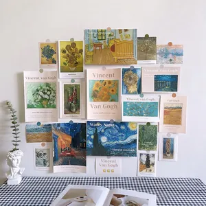 Detailed view of Van Gogh and Monet art cards displayed on a white Nordic style wall