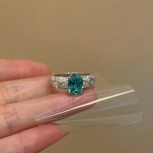Elegant oval blue zircon open ring with quilted pattern and micro-pavé crystals