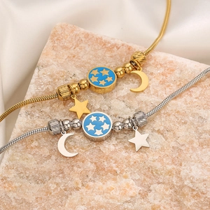 Titanium steel bracelet featuring star and moon charms with blue enamel star dial