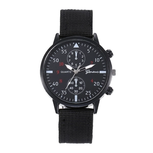 Macro shot of men's quartz watch showing black woven nylon strap and sporty numeric dial