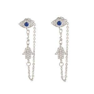 Macro shot of silver evil eye stud with hanging chain and Hamsa hand charm detail