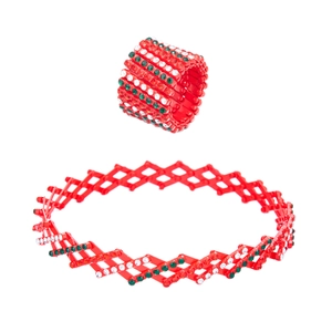 Red magic transformable ring to bracelet detail with sparkling green and white crystals