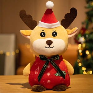 Close-up of plush Christmas reindeer toy with Merry Christmas ribbon and red hat