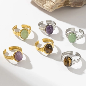 Detail of bohemian adjustable rings with natural tiger eye and amethyst stones
