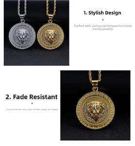 Close-up of gold and silver lion head pendants with sparkling crystal inlay details