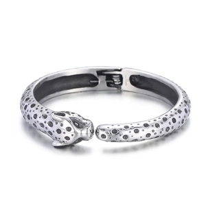 Silver stainless steel leopard head open bracelet featuring a punk design on white background