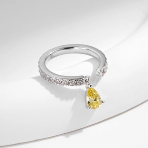 S925 silver adjustable ring featuring white zircon pave and a yellow teardrop stone charm