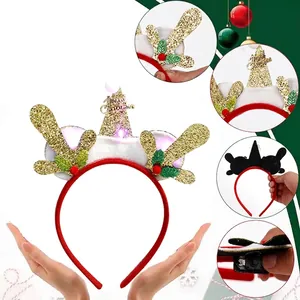LED Christmas reindeer antler headband with festive holly leaves and golden glitter trim