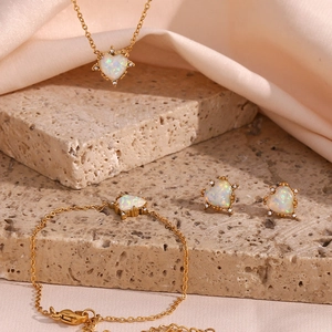 Gold-plated stainless steel jewelry set with heart-shaped opal and zircon accents
