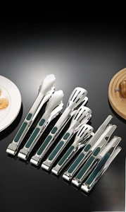 Detail of SUS304 stainless steel food tongs set with green non-slip silicone handles