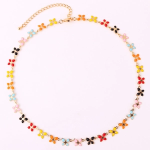 Gold chain necklace with colorful butterfly flower charms and lobster clasp on white background