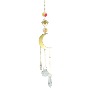 Detail of moon and star suncatcher with multi-faceted crystal prisms in golden finish