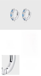 Close-up of S925 silver earrings featuring hand-pave 5A blue and white zircon stones