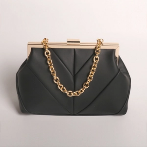 Elegant black quilted evening clutch bag with chunky gold chain strap and metal frame
