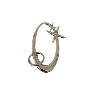 Silver metal oval carabiner keychain with dual cross star pendants on a white background