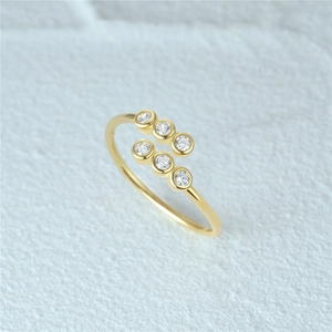 Macro shot of gold S925 sterling silver ring showing S925 stamp and cubic zirconia detail