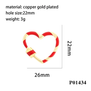 Detail of red enamel heart-shaped screw clasp in gold-plated copper for DIY jewelry