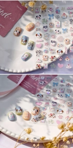Detail of 3D embossed dog nail stickers with cute puppy, bow and dessert patterns