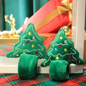 Pair of plush green Christmas tree snap bracelets for kids with colorful embroidery details