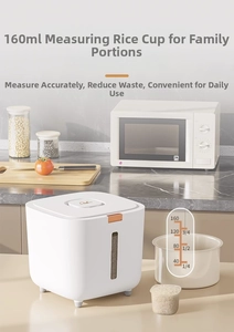 Detail of white airtight rice container with measuring cup and visual window