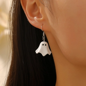 Close-up of cute white ghost drop earrings for Halloween with a matte finish and silver hooks