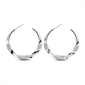 Silver twisted C-shape hoop earrings with 18K plating and sparkling cubic zirconia stones