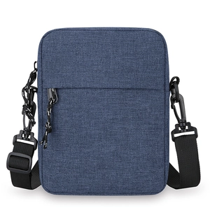 Versatile dark blue crossbody bag made of textured fabric with adjustable black strap