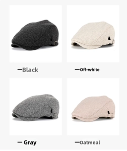 Detail of wool newsboy caps in black, cream, grey and oat with side buckle strap