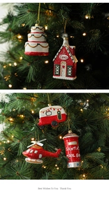 Detailed view of red and white painted Christmas ornaments hanging on a festive tree