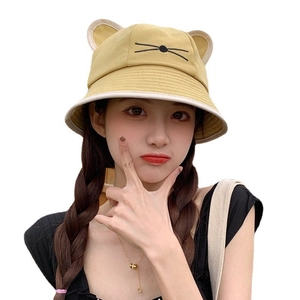 Cute yellow cotton bucket hat for women with cat ears and embroidered face detail