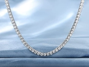 Close-up of 18K white gold plated tennis necklace with round-cut cubic zirconia stones