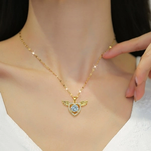 Gold winged heart necklace for women featuring a sparkling crystal pendant and paved rhinestones