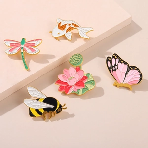 Exquisite enamel pins set featuring koi fish, dragonfly, and butterfly with gold-plated edges