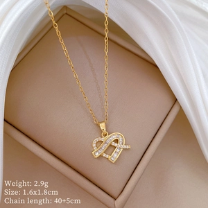 Detailed macro view of gold heart necklace with sparkling zircons in a jewelry box