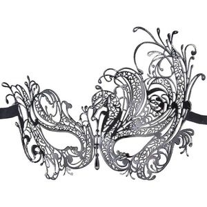 Detail of black laser-cut masquerade mask with intricate patterns and satin ribbons