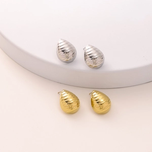 Minimalist stainless steel teardrop earrings in gold and silver with striped texture