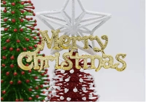Close-up of golden Merry Christmas decorative sign for holiday tree and baking decor