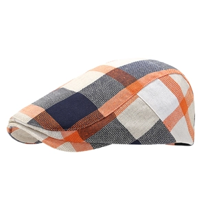 Classic vintage plaid octagonal flat cap in orange and navy blue check pattern