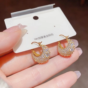 Macro shot of 14K gold plated hoop earrings with micro-pave white zircon stones