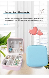Detail of portable jewelry box showing necklace hooks and ring slots in cross pattern PU leather