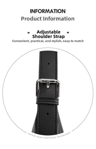 Detail of adjustable black leather shoulder strap with silver buckle and perforated design