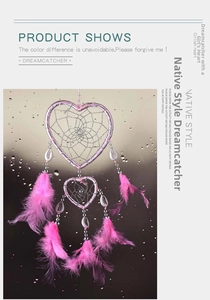 Detail of pink double heart dreamcatcher with white shells and soft feathers